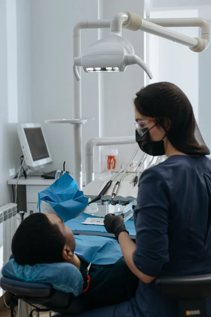Dentist with a patient in a modern dental operatory